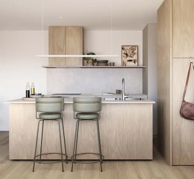 Artist impression of a Motif kitchen in the Comfort scheme, oak joinery, stone island bench and green leather stools