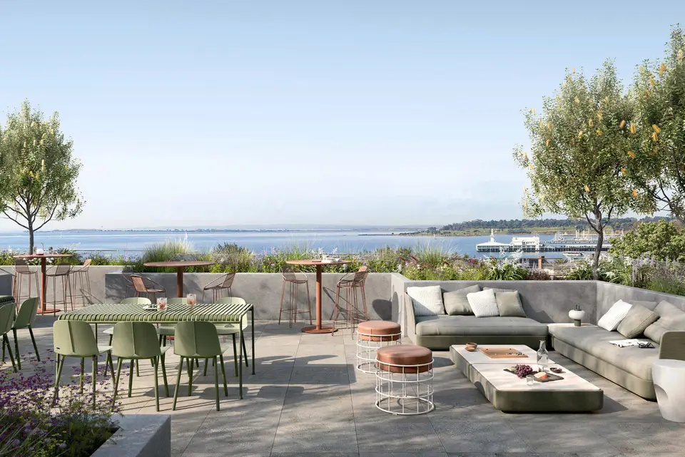 Artist impression of the Motif community rooftop amenities overlooking Corio Bay, dining tables and lounge seating among planting
